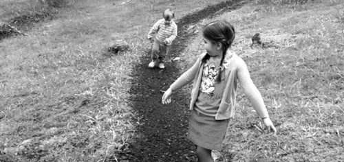 Children running through the woods